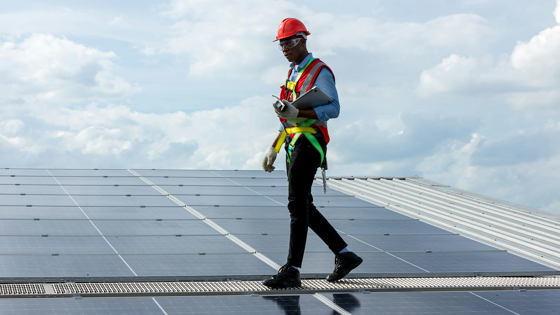 A man working on a solar panel array