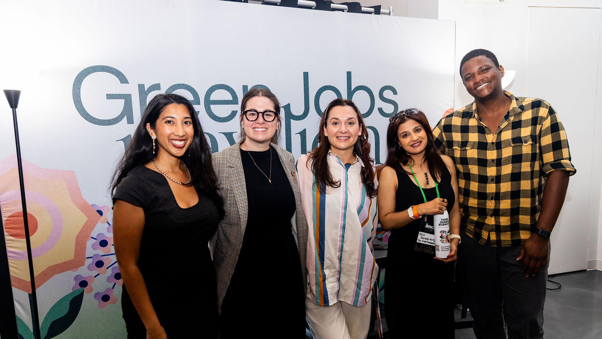 Project Drawdown's Matt Scott stands with Kristy Drutman and others after a panel at the Green Jobs Pavilion during Climate Week NYC
