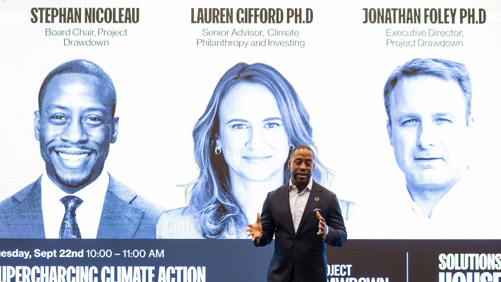 An image of Project Drawdown Board Chair Stephan Nicoleau presenting with Lauren Gifford and Jonathan Foley at Solutions House during Climate Week NYC