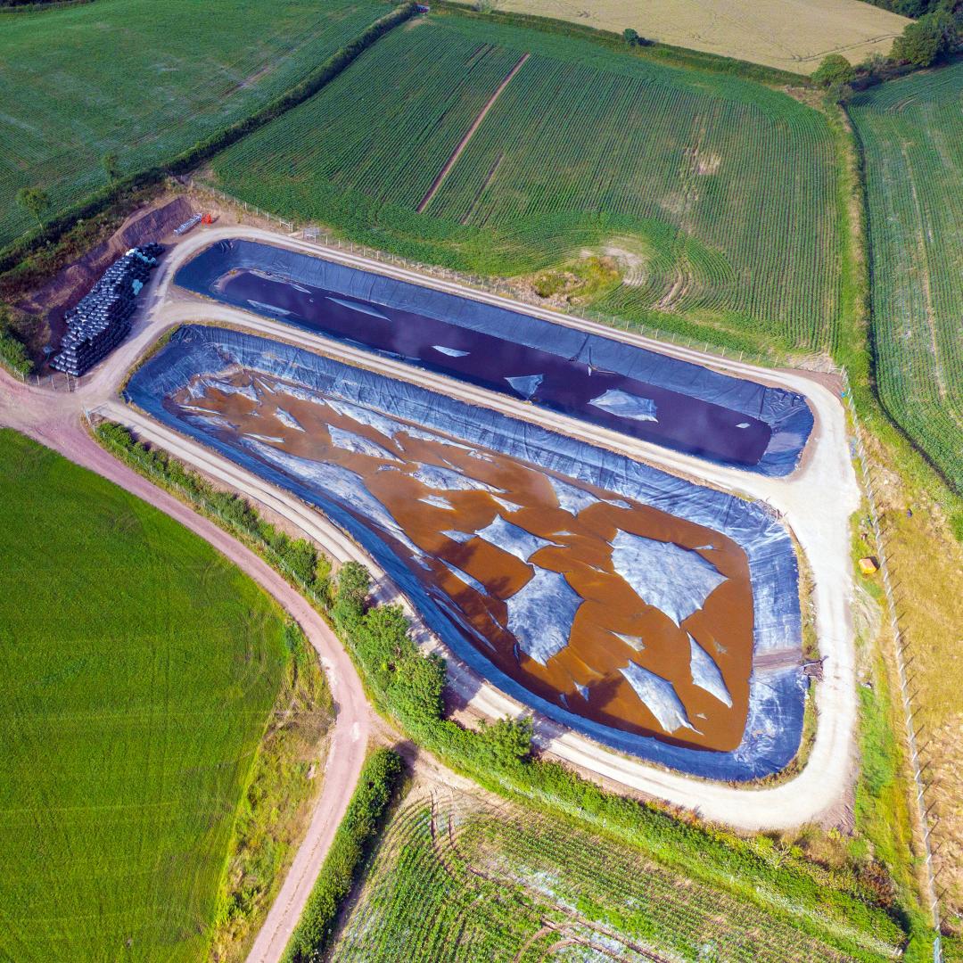An image of a manure pit in an agricultural field