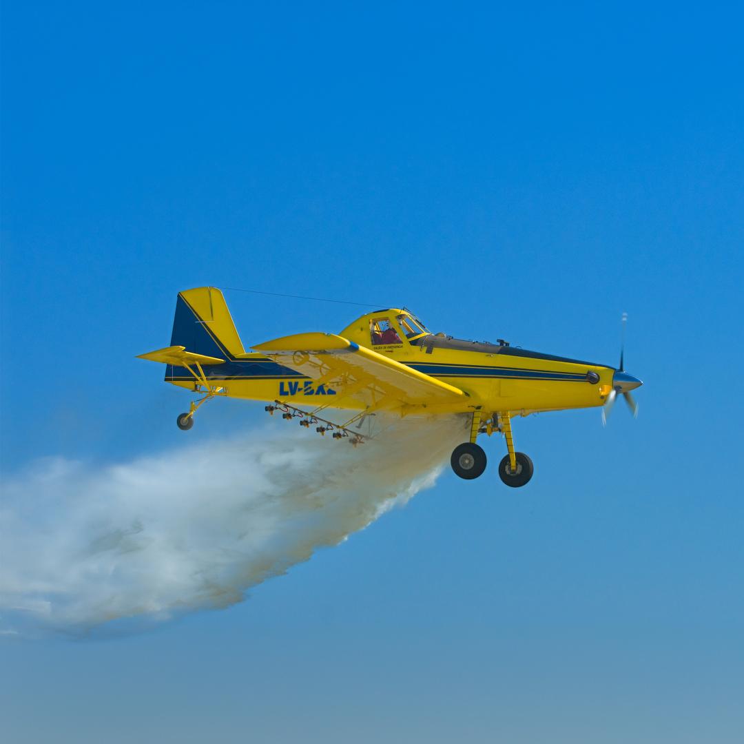 Airplane releasing material into the air