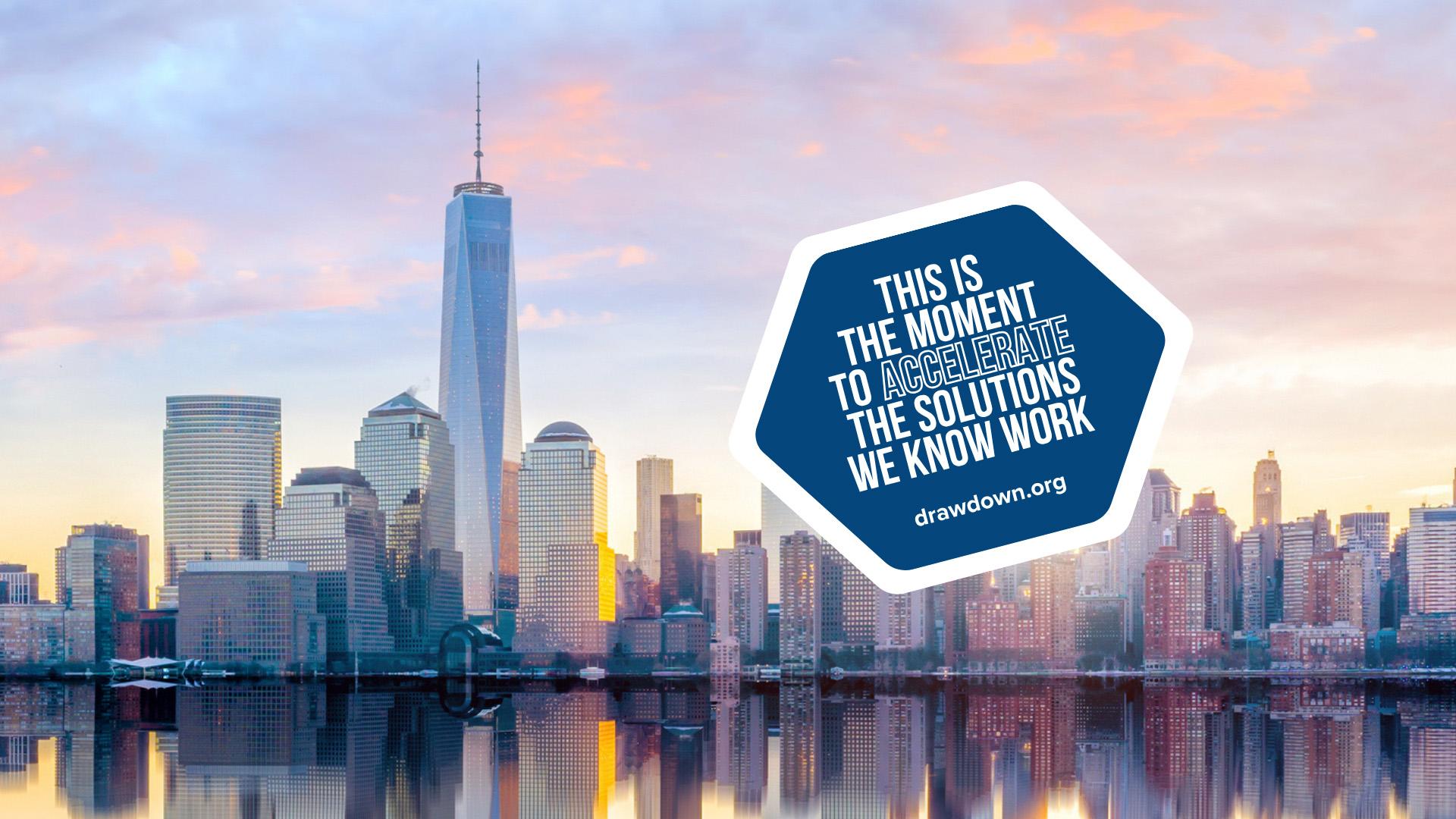 An image of the New York City skyline with a graphic that reads 'This is the moment to accelerate the solutions we know work'