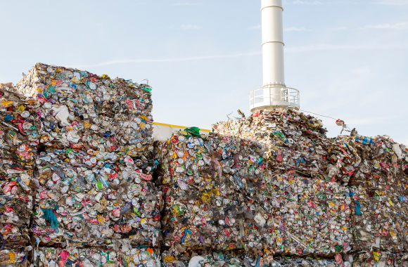 An image of pallets of waste in front of a waste to energy facility